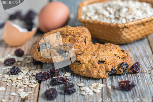 Image of Homemade oatmeal cookies, eggs and raisins.