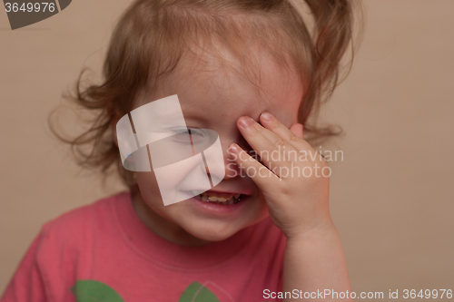 Image of portrait of a smiling little girl