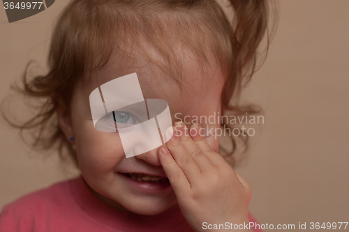 Image of portrait of a smiling little girl