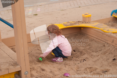 Image of girl in a sandbox