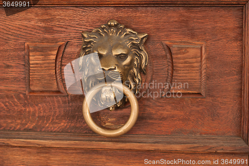 Image of bas-relief of a lion's head with a ring in its mouth