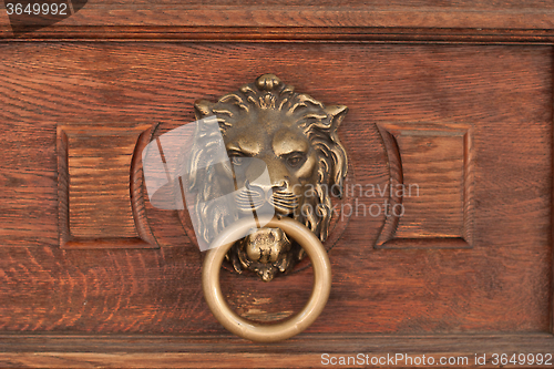 Image of bas-relief of a lion's head with a ring in its mouth