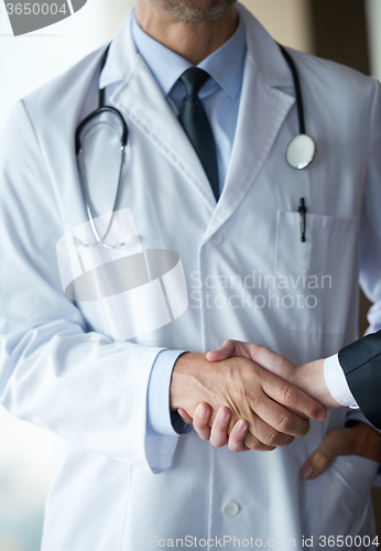 Image of doctor handshake with a patient