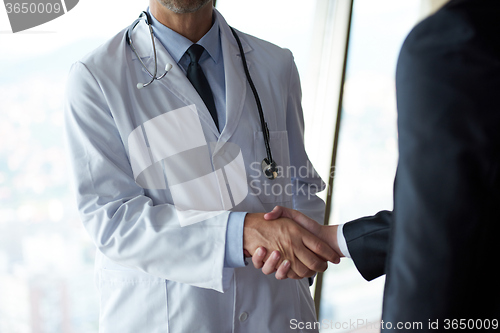 Image of doctor handshake with a patient