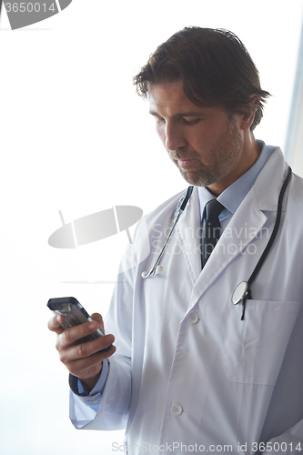 Image of doctor speaking on cellphone
