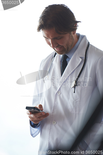Image of doctor speaking on cellphone