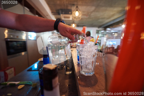 Image of barman prepare fresh coctail drink