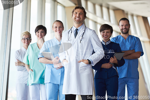 Image of group of medical staff at hospital, handsome doctor in front of 