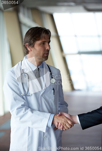 Image of doctor handshake with a patient