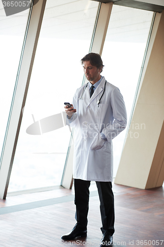 Image of doctor speaking on cellphone