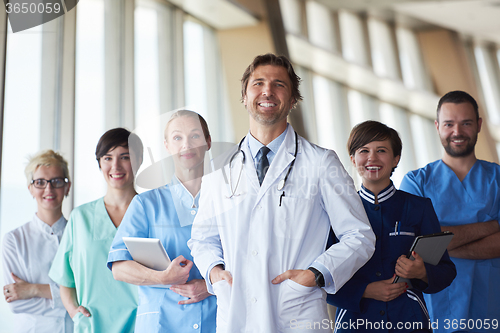 Image of group of medical staff at hospital, handsome doctor in front of 