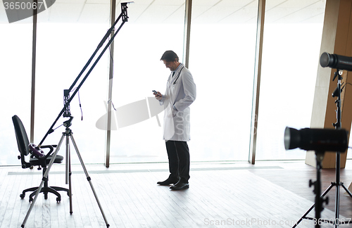 Image of doctor speaking on cellphone