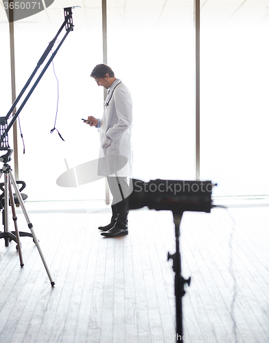 Image of doctor speaking on cellphone