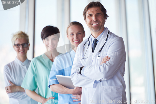 Image of group of medical staff at hospital, handsome doctor in front of 