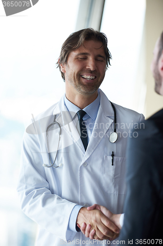 Image of doctor handshake with a patient