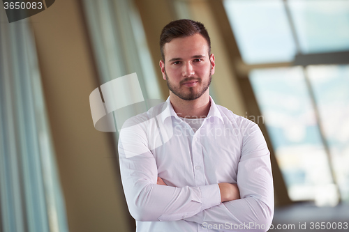 Image of business man with beard at modern office