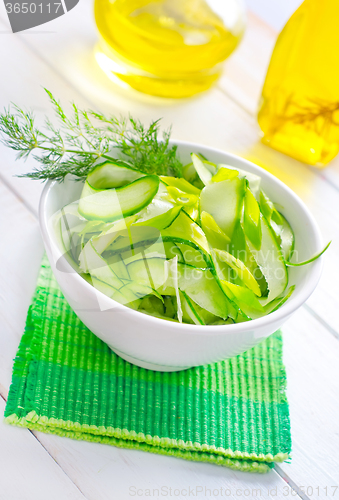 Image of Fresh salad with cucumber and greens