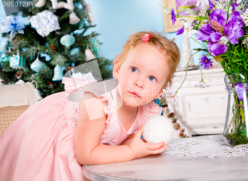 Image of Girl decorate the Christmas tree