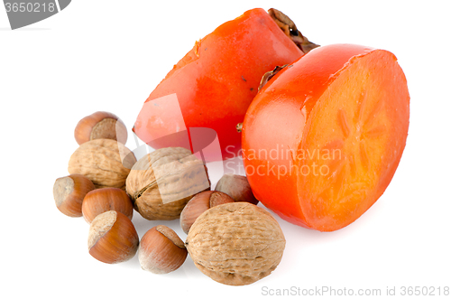 Image of Ripe persimmons and nuts