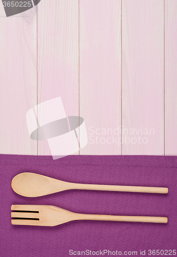 Image of Kitchenware on purple towel