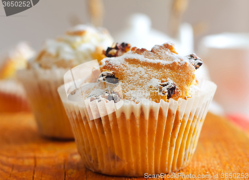 Image of Sweet Muffins with tea on the table