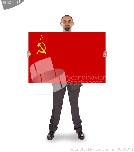 Image of Smiling businessman holding a big card, flag of the USSR