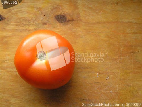 Image of tomato on wooden board