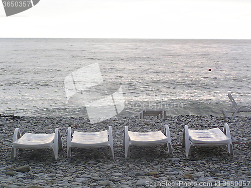 Image of deck chairs on the beach
