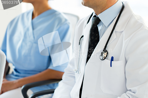 Image of close up of happy doctors at seminar or hospital