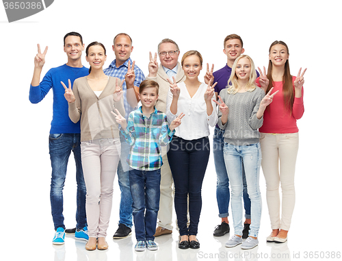 Image of group of smiling people showing peace hand sign