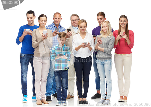 Image of group of smiling people with smartphones