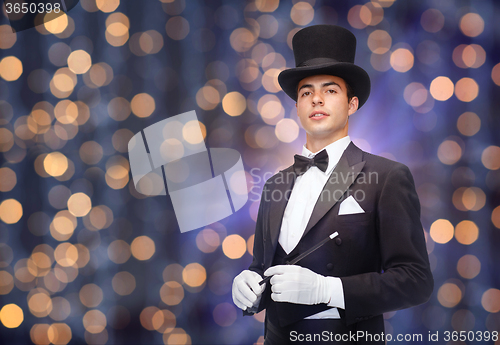 Image of magician in top hat with magic wand