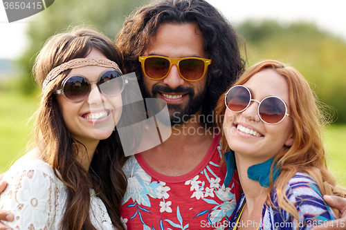 Image of smiling young hippie friends outdoors