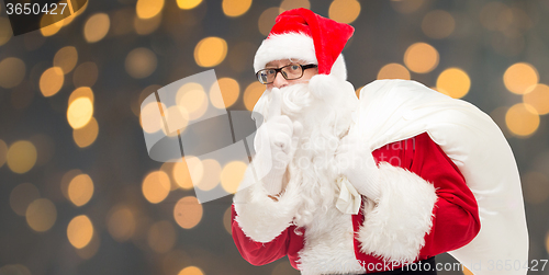 Image of man in costume of santa claus with bag