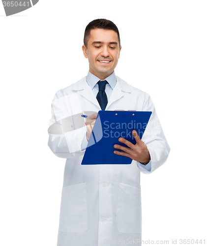 Image of smiling male doctor with clipboard writing