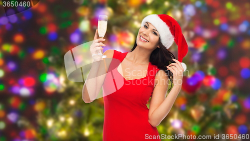 Image of beautiful sexy woman in santa hat and red dress