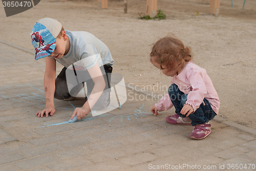 Image of Children draw in the street