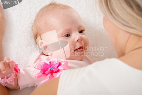 Image of The two-month baby looking at mother