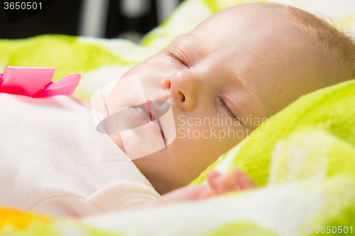 Image of Close-up of a sleeping baby in the crib