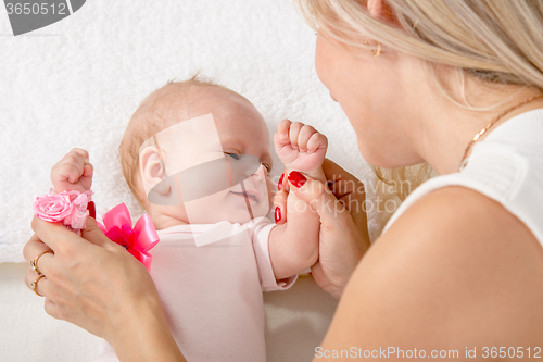 Image of Mom kneads two-handle baby