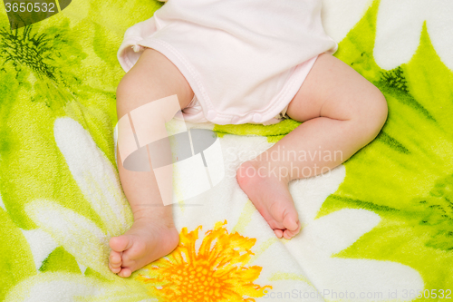 Image of Small legs sleeping baby