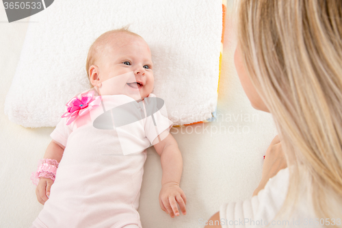 Image of Happy two-month girl looking at mother