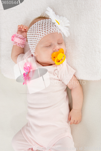 Image of Half-length portrait of two months sleeping girl