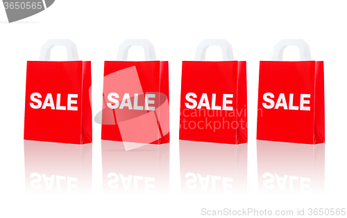 Image of many red shopping bags with sale word