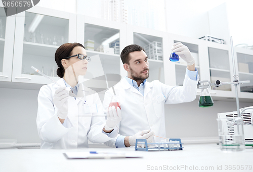 Image of young scientists making test or research in lab