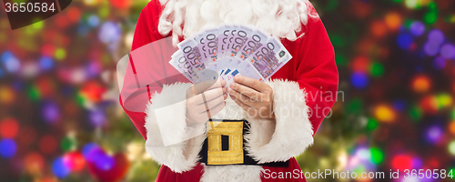 Image of close up of santa claus with euro money