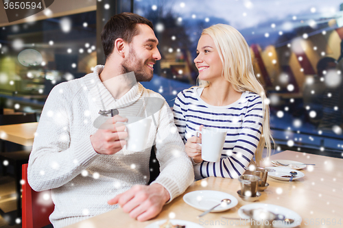 Image of happy couple meeting and drinking tea or coffee