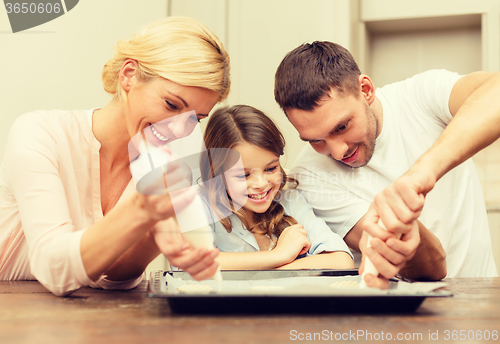 Image of happy family in making cookies at home