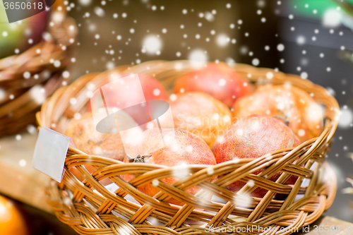 Image of ripe pomegranates in basket at food market