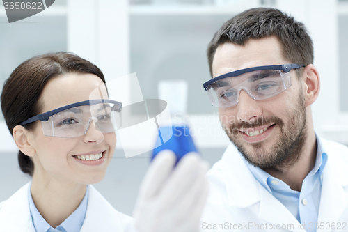 Image of young scientists making test or research in lab